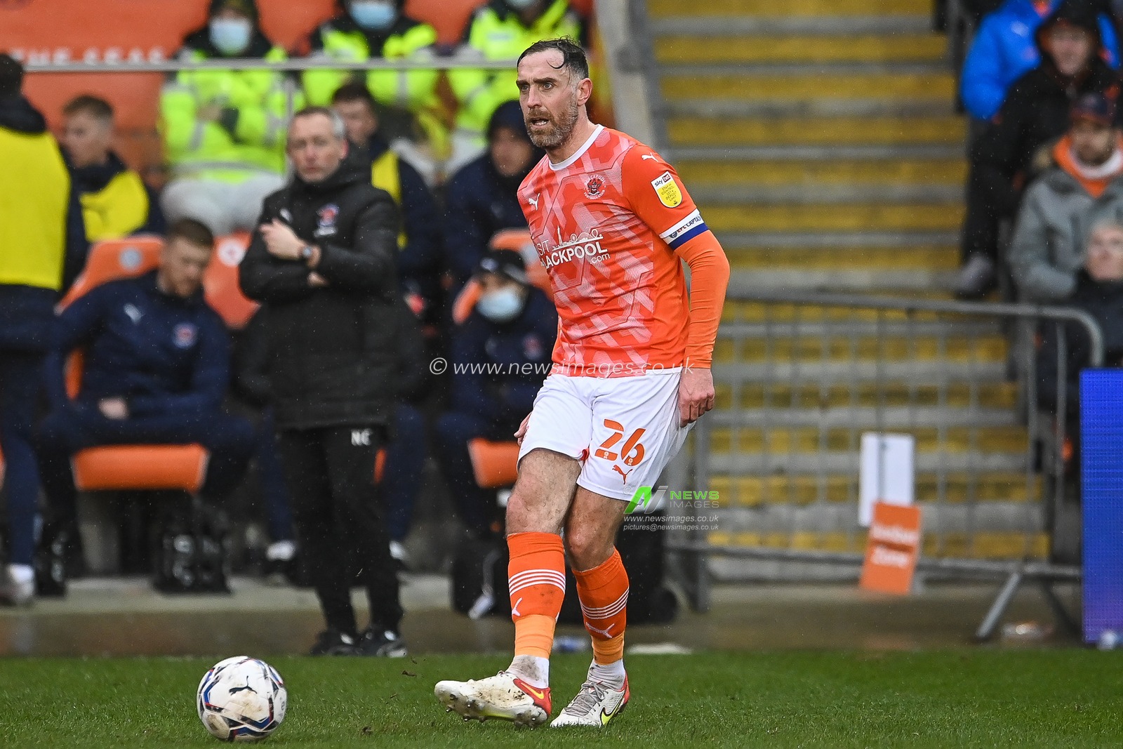 Richard Keogh #26 of Blackpool passes the ball