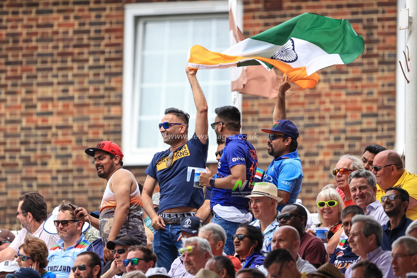 India fans sing and wave their flag