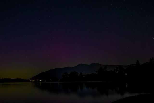 Northern Lights also know as the Aurora Borealis shines over Derwent Water