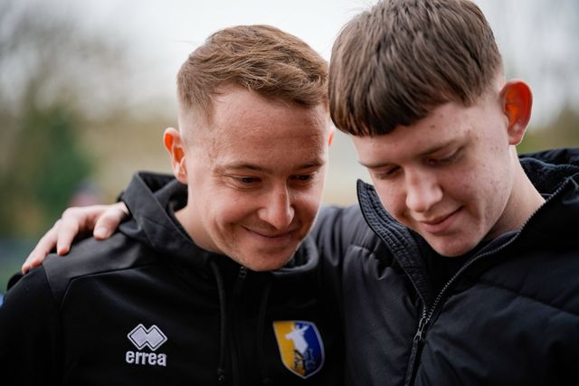 Louis Reed of Mansfield Town signs an autograph for a fan during the Emirates FA Cup fifth round match Mansfield Town vs Arsenal at One Call Stadium, Mansfield, United Kingdom on 07 March 2026

(Photo by Maynard Manyowa/News Images)