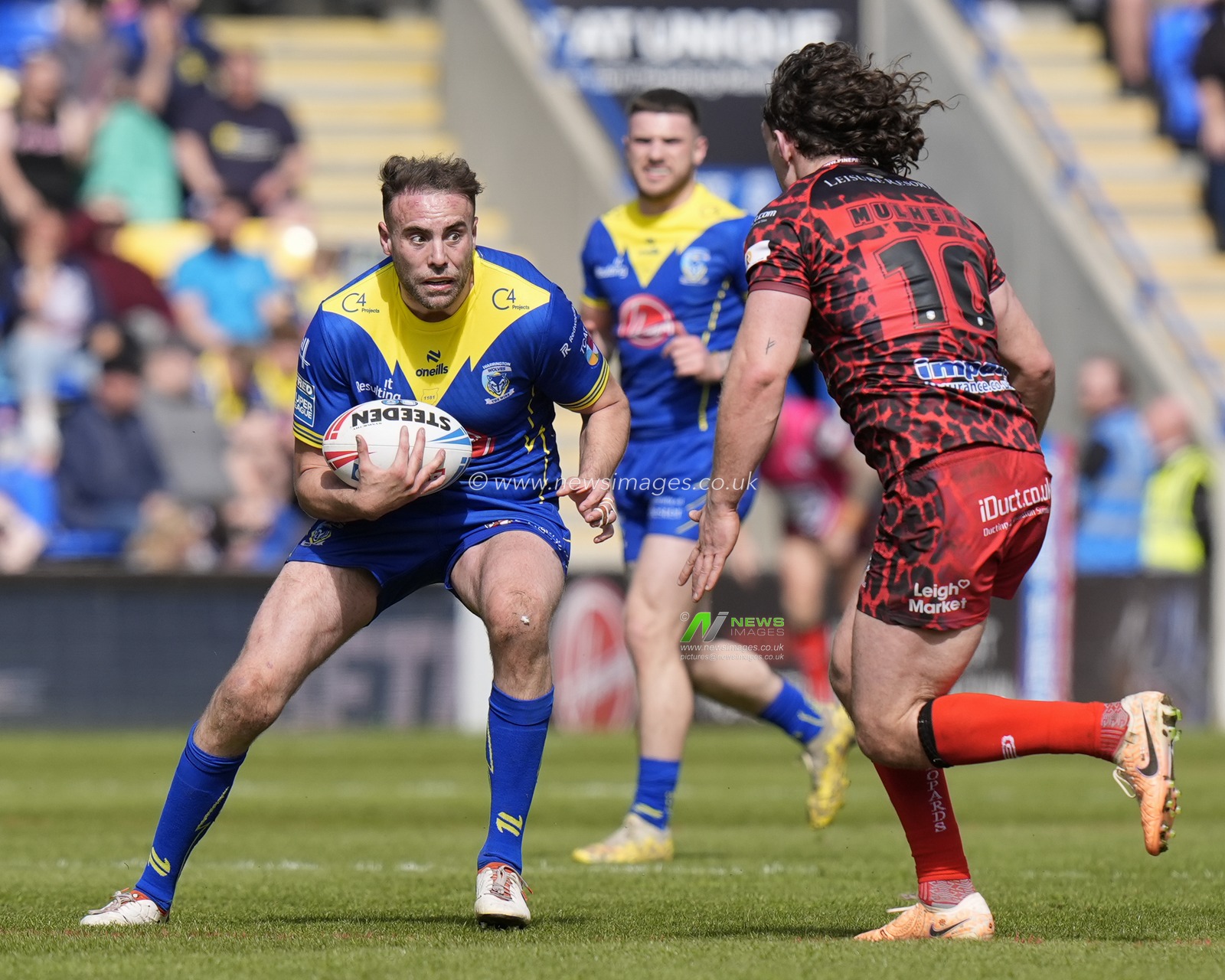 James Harrison of Warrington Wolves cuts back on Robbie Mulhern of Leigh Leopards during the Betfred Super League Round 8 match Warrington Wolves vs Leigh Leopards at Halliwell Jones Stadium, Warrington, United Kingdom, 20th April 2024

(Photo by Steve Flynn/News Images)