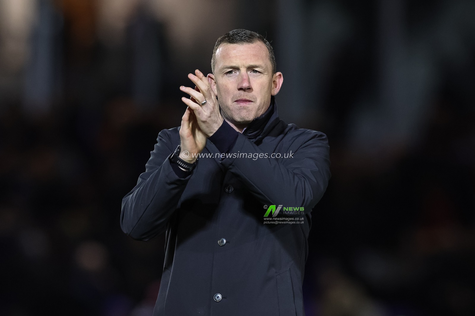 Neill Collins Head coach of Barnsley applauds the travelling fans during the Sky Bet League 1 match Peterborough United vs Barnsley at Weston Homes Stadium, Peterborough, United Kingdom, 29th December 2023

(Photo by Mark Cosgrove/News Images)