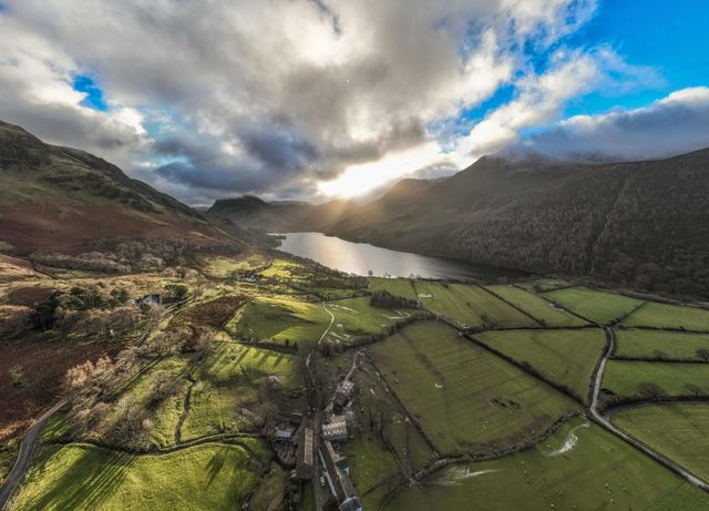 ***EDITORS NOTE THIS IS A PANO PHOTO MADE FROM MULTIPLE SHOTS FROM THE DRONE AND FINISHED IN CAMERA***

An Aerial view of Buttermere and the surrounding mountains during a cold winters morning at Buttermere, TheLake District, Cumbria, United Kingdom, 3rd January 2025

(Photo by Mark Cosgrove/News Images)