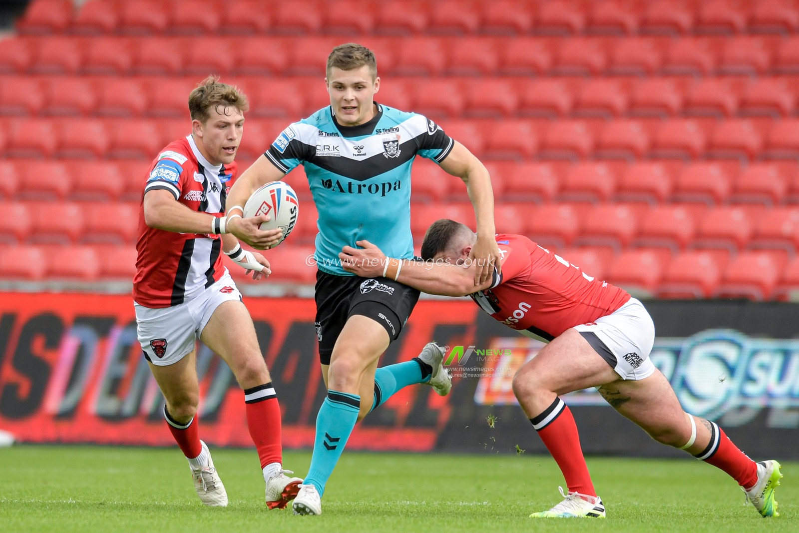 Cameron Scott (24) of Hull FC runs forward with the ball