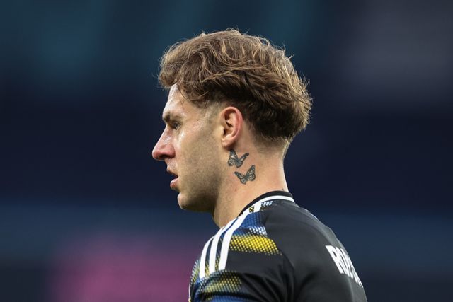 The butterfly neck tattoo of Joe Rodon of Leeds United during the Premier League match Manchester City vs Leeds United at Etihad Stadium, Manchester, United Kingdom, 29th November 2025

(Photo by Mark Cosgrove/News Images)

*** GER AUT SUI OUT ***