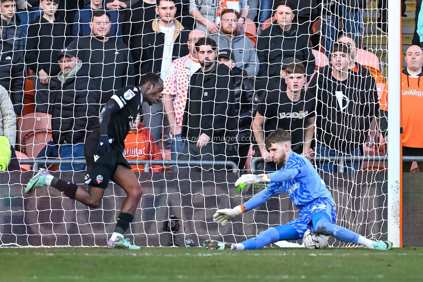 Daniel Grimshaw of Blackpool saves a shot from Carlos Mendes Gomes of Bolton Wanderers during the Sky Bet League 1 match Blackpool vs Bolton Wanderers at Bloomfield Road, Blackpool, United Kingdom, 24th February 2024

(Photo by Craig Thomas/News Images)
