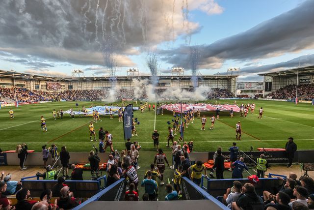 The teams come out for the game during the Betfred Super League round 21 match Warrington Wolves vs Wigan Warriors at Halliwell Jones Stadium, Warrington, United Kingdom, 8th August 2025

(Photo by Alfie Cosgrove/News Images)