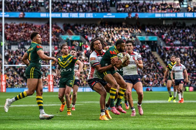 Josh Addo-Carr of Australia is tackled by Dom Young of England  of England during the The Ashes Series 2025 England vs Australia at Wembley Stadium, London, United Kingdom, 25th October 2025

(Photo by Alfie Cosgrove/News Images)