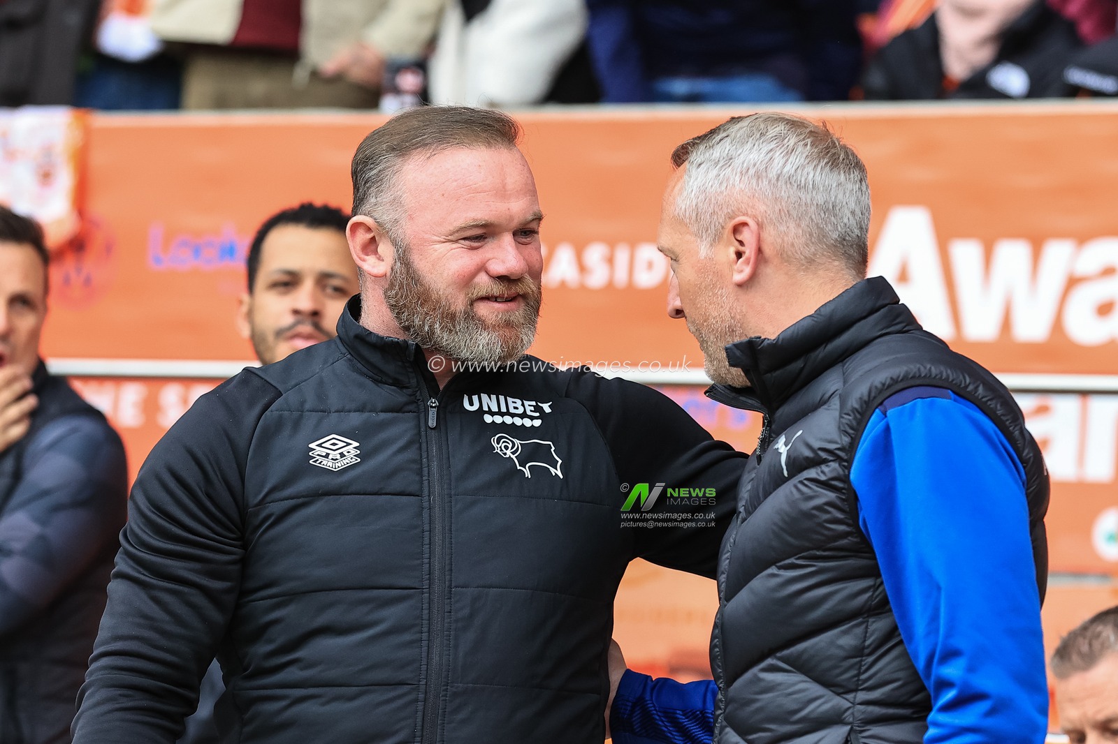 Neil Critchley head coach of Blackpool welcomes Wayne Rooney manager of Derby County