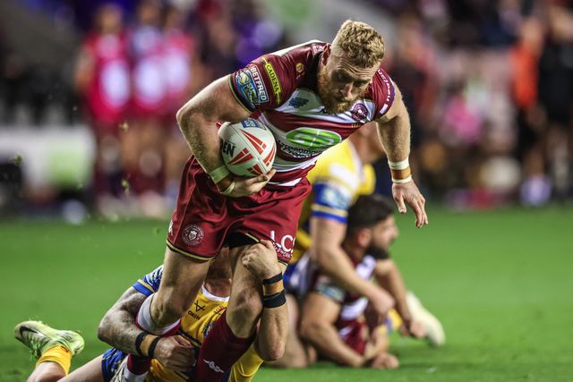 Luke Thompson of Wigan Warriors is tackled during the Betfred Super League round 27 match Wigan Warriors vs Leeds Rhinos at The Brick Community Stadium, Wigan, United Kingdom, 19th September 2025

(Photo by Alfie Cosgrove/News Images)