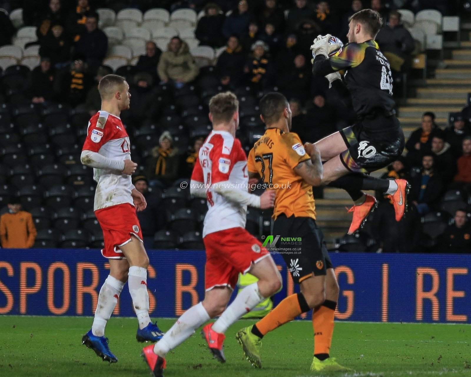 26th February 2020, KC Stadium, Kingston upon Hull, England; Sky Bet Championship, Hull City v Barnsley : Bradley Collins (40) of Barnsley gets up high to gather the ball
