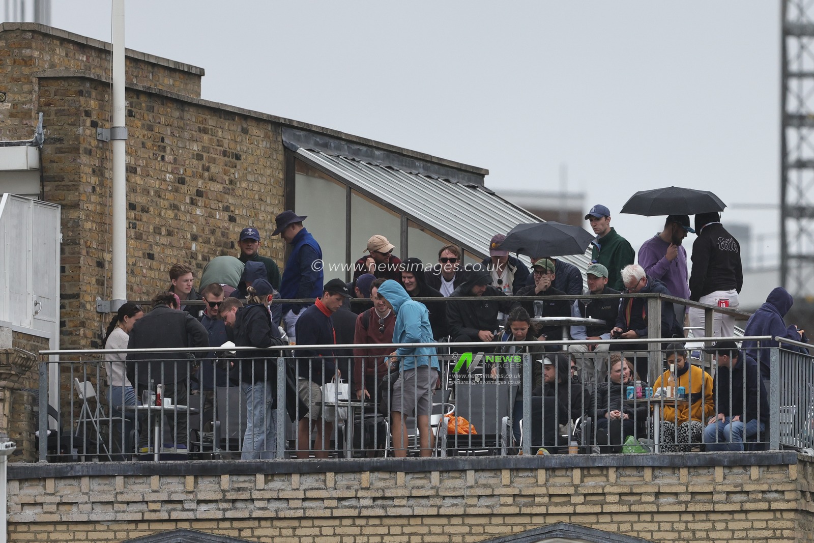 Fans get their brollyâ€™s out as it starts to rain during the LV= Insurance Ashes Fifth Test Series Day Four match England vs Australia at The Kia Oval, London, United Kingdom, 30th July 2023

(Photo by Mark Cosgrove/News Images)