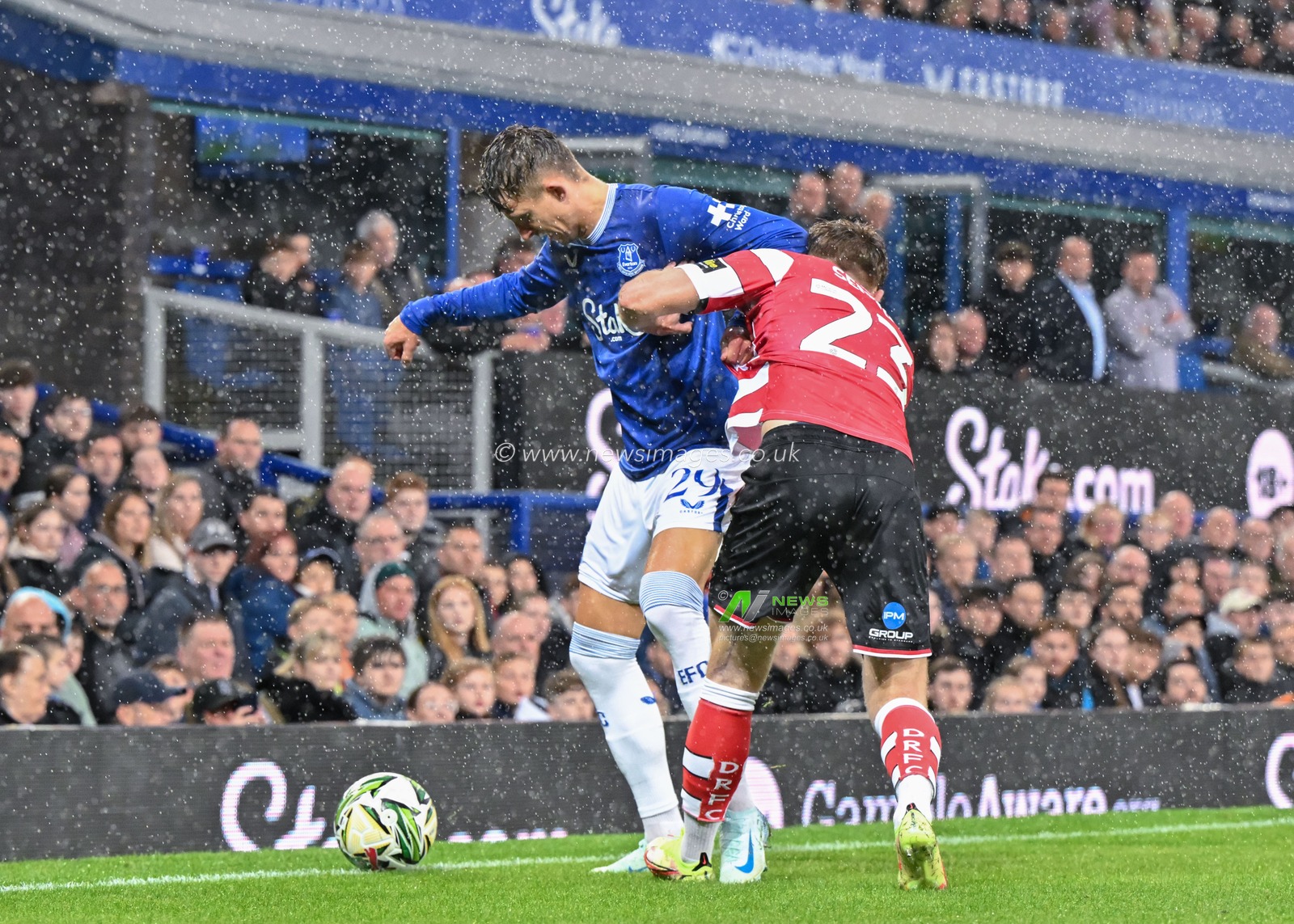 Jesper LindstrÃ¸m of Everton holds off Jack Senior of Doncaster Rovers during the Carabao Cup match Everton vs Doncaster Rovers at Goodison Park, Liverpool, United Kingdom, 27th August 2024

(Photo by Cody Froggatt/News Images)