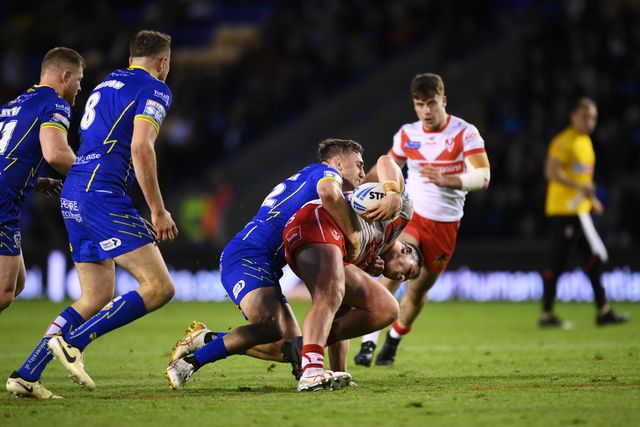 Tommy Makinson of St. Helens is challenged during the Betfred Super League play-off Eliminator 2 Warrington Wolves v St Helens at Halliwell Jones Stadium, Warrington, United Kingdom, 28th September 2024

(Photo by Ben Roberts/News Images)