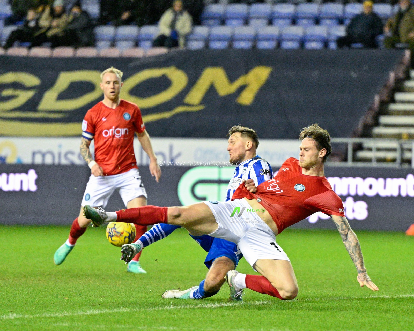 Joe Low of Wycombe Wanderers tackles Charlie Wyke of Wigan Athletic in the box, during the Sky Bet League 1 match Wigan Athletic vs Wycombe Wanderers at DW Stadium, Wigan, United Kingdom, 23rd January 2024

(Photo by Cody Froggatt/News Images)