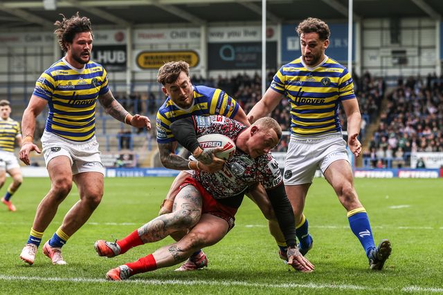 Josh Charnley of Leigh Leopards is tackled by Matty Ashton of Warrington Wolves and Toby King of Warrington Wolves during the Betfred Super League round 7 match Warrington Wolves vs Leigh Leopards at The Halliwell Jones Stadium, Warrington, United Kingdom on 04 April 2026

(Photo by Alfie Cosgrove/News Images)