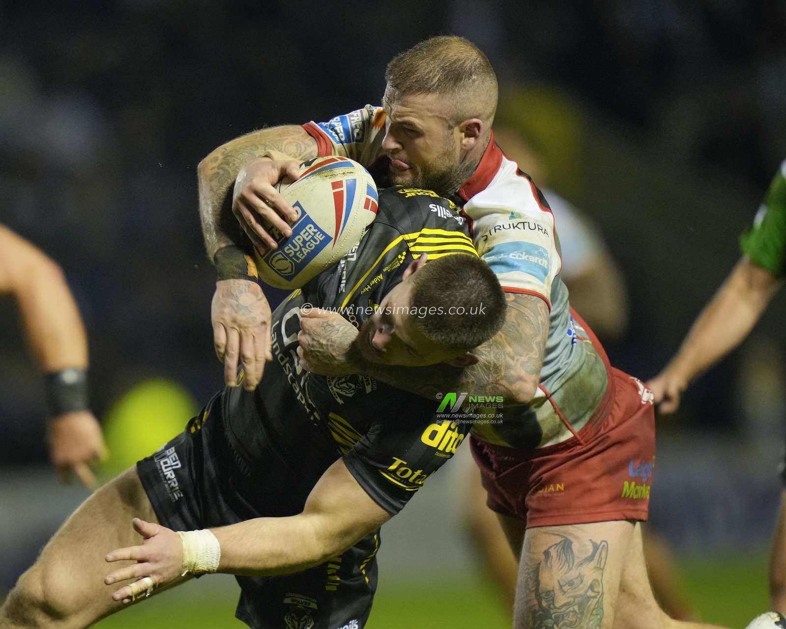 Zak Hardaker #1 of Leigh Leopards tackles Danny Walker #16 of Warrington Wolves during the Rugby League Ben Currie Testimonial match Warrington Wolves vs Leigh Leopards at Halliwell Jones Stadium, Warrington, United Kingdom, 4th February 2023

(Photo by Steve Flynn/News Images)