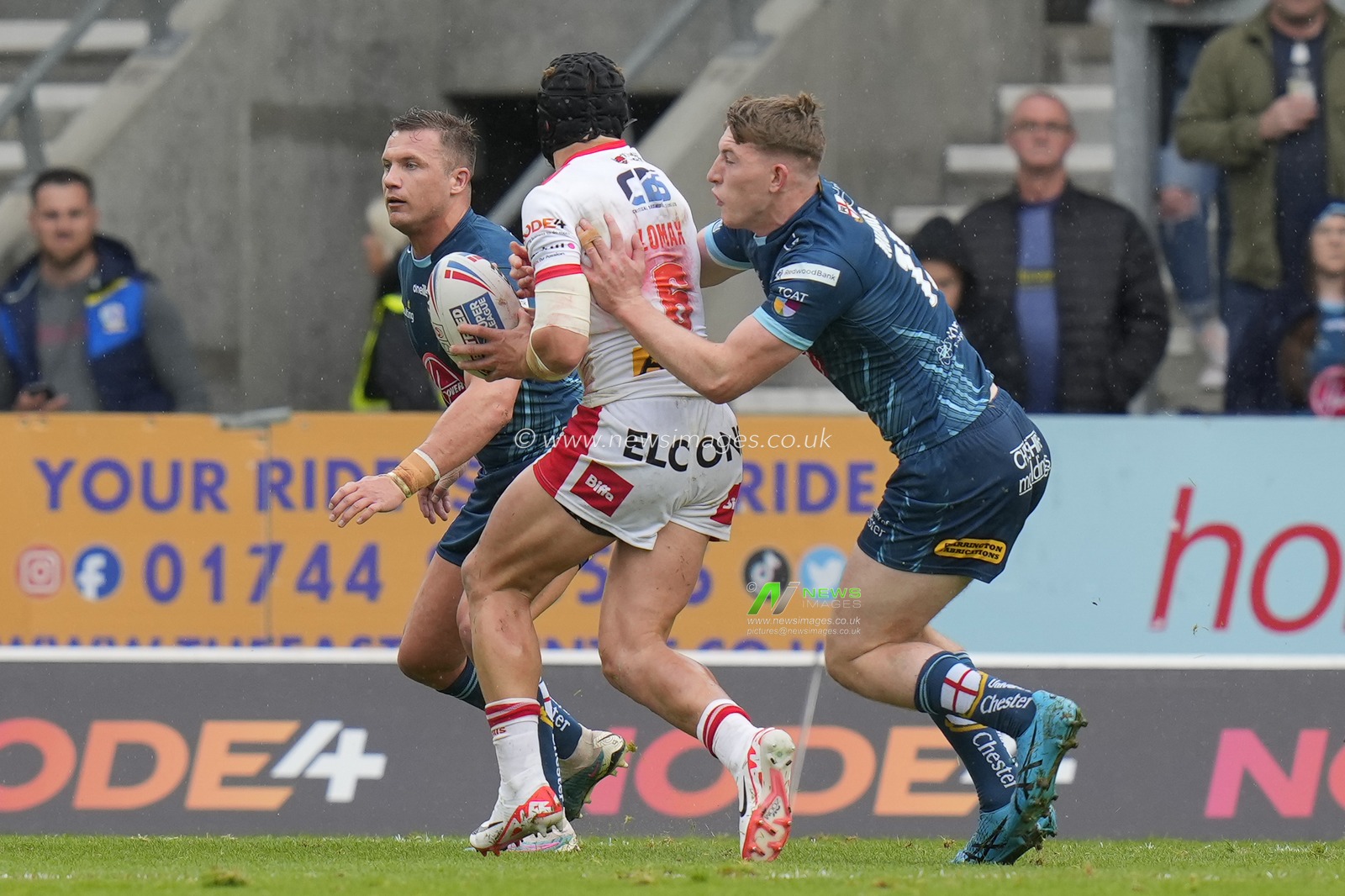 Matty Nicholson #12 of Warrington Wolves forces a loose carry from Jonny Lomax #6 of St. Helens during the Betfred Super League Eliminator match St Helens vs Warrington Wolves at Totally Wicked Stadium, St Helens, United Kingdom, 30th September 2023

(Photo by Steve Flynn/News Images)
