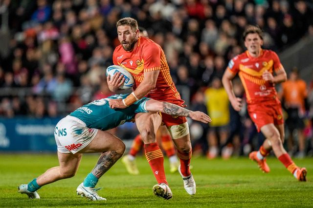 Julian Bousquet of Catalans Dragons is tackled by George Delaney of St Helens during the Betfred Challenge Cup Quarter Final match St Helens vs Catalans Dragons at The BrewDog Stadium, St Helens, United Kingdom on 10 April 2026

(Photo by Maynard Manyowa/News Images)