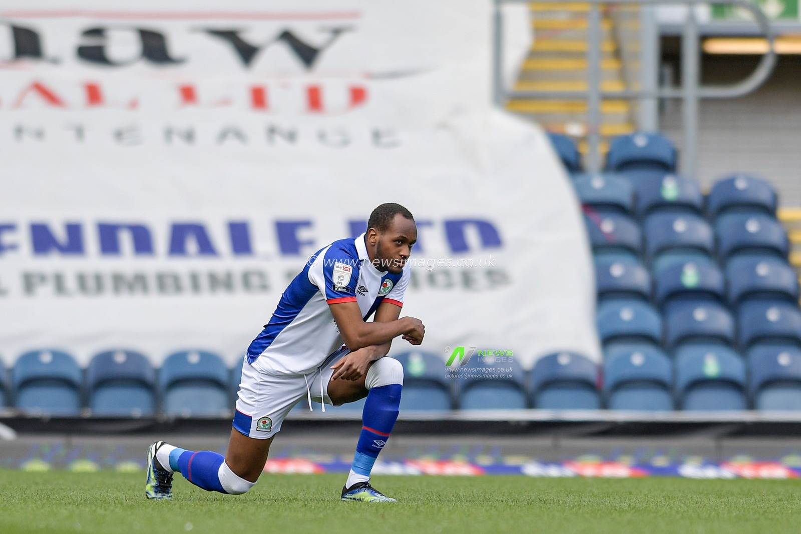 Ryan Nyambe #2 of Blackburn Rovers takes a knee before the game