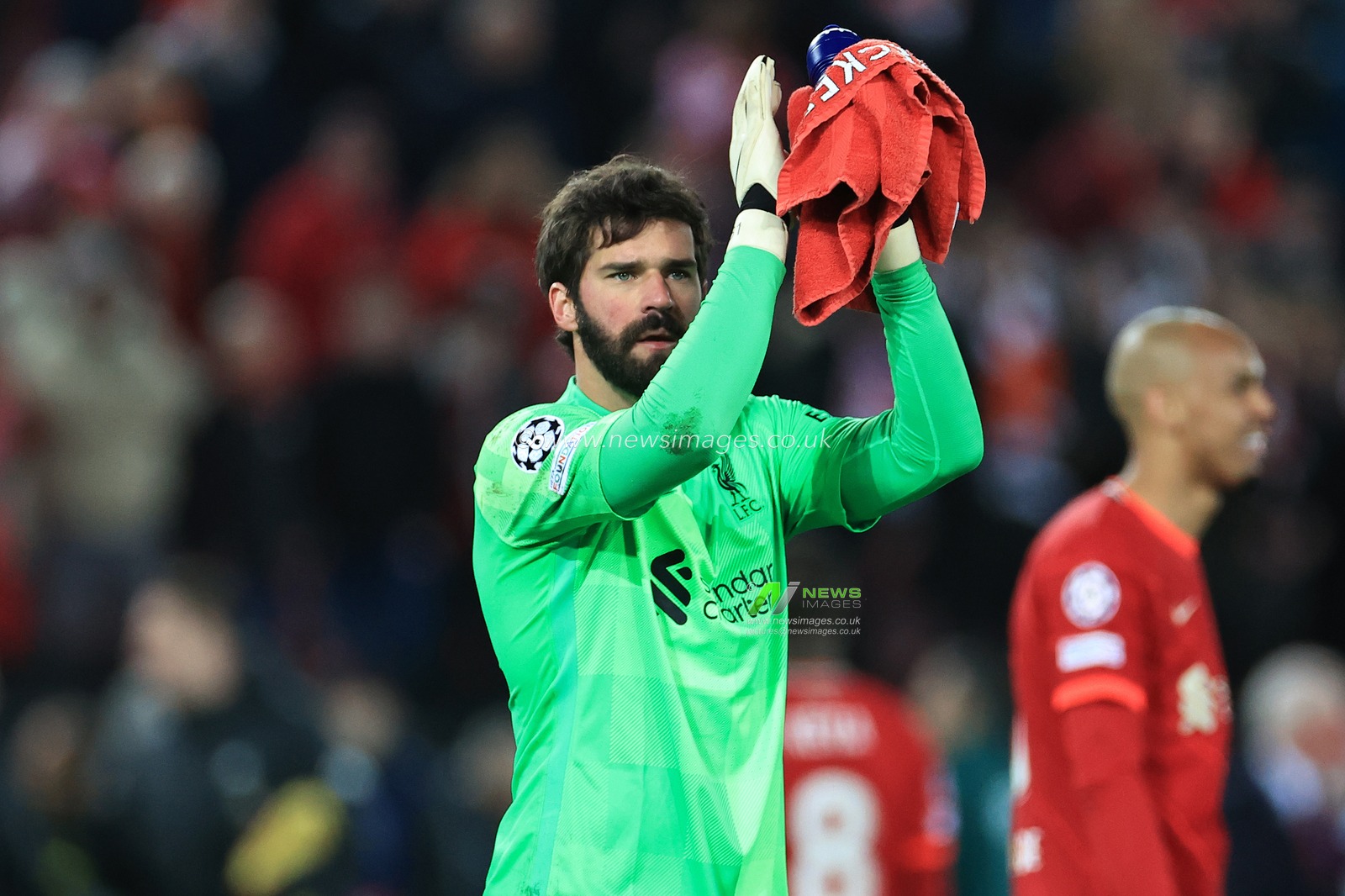 Alisson Becker #1 of Liverpool applauds the fans at the final whistle