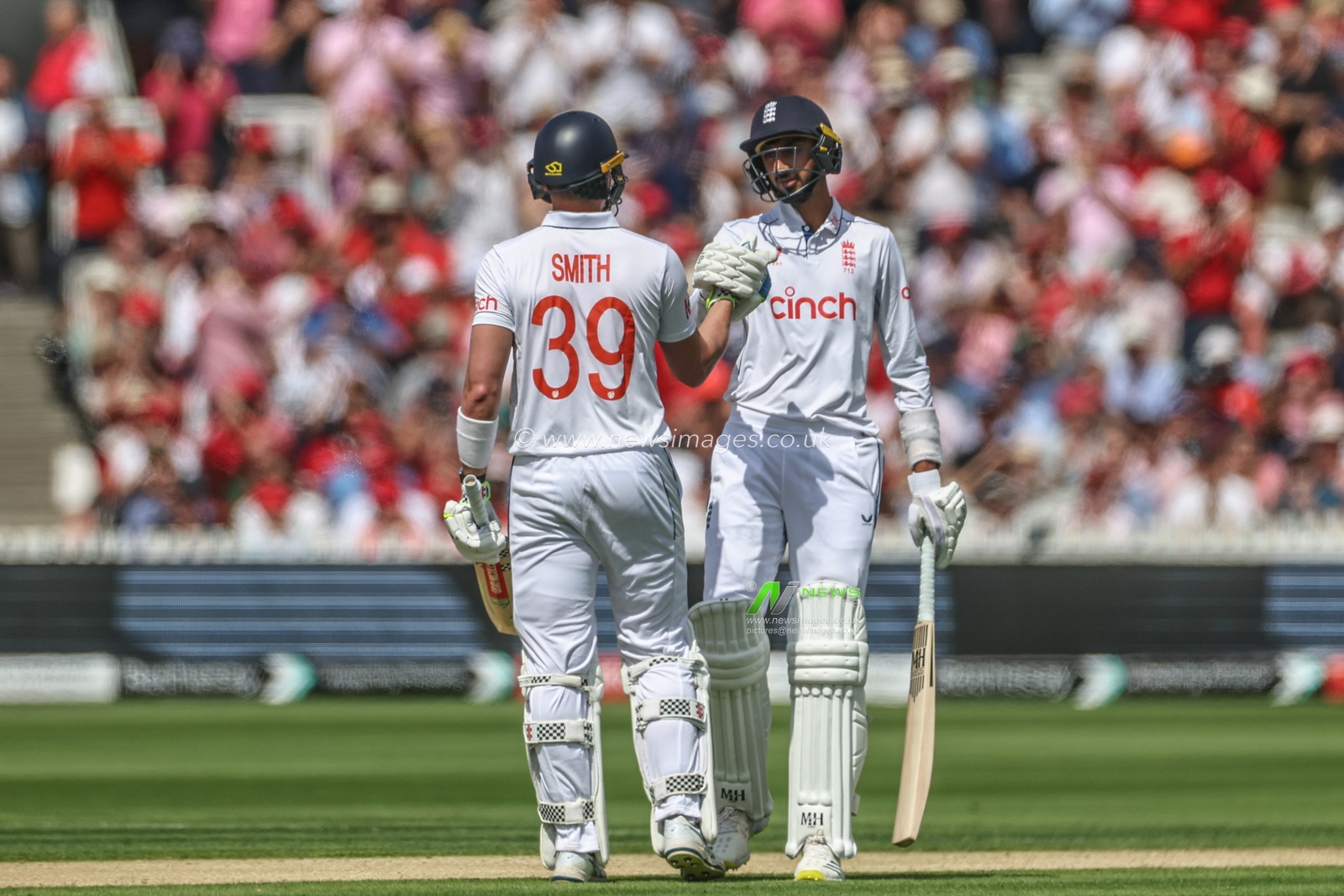 Shoaib Bashir of England fist bumps Jamie Smith of England after Smith hits the ball for one run to get his half century (50 runs) during the Rothesay Test Match Day Two England v West Indies at Lords, London, United Kingdom, 11th July 2024

(Photo by Mark Cosgrove/News Images)