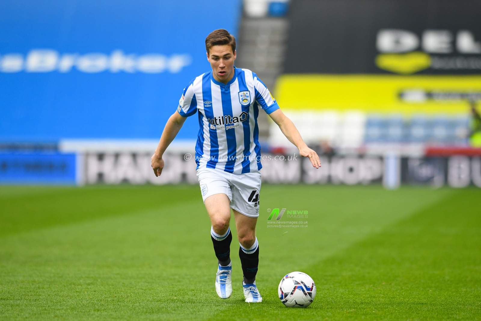 Carel Eiting #48 of Huddersfield Town runs forward with the ball