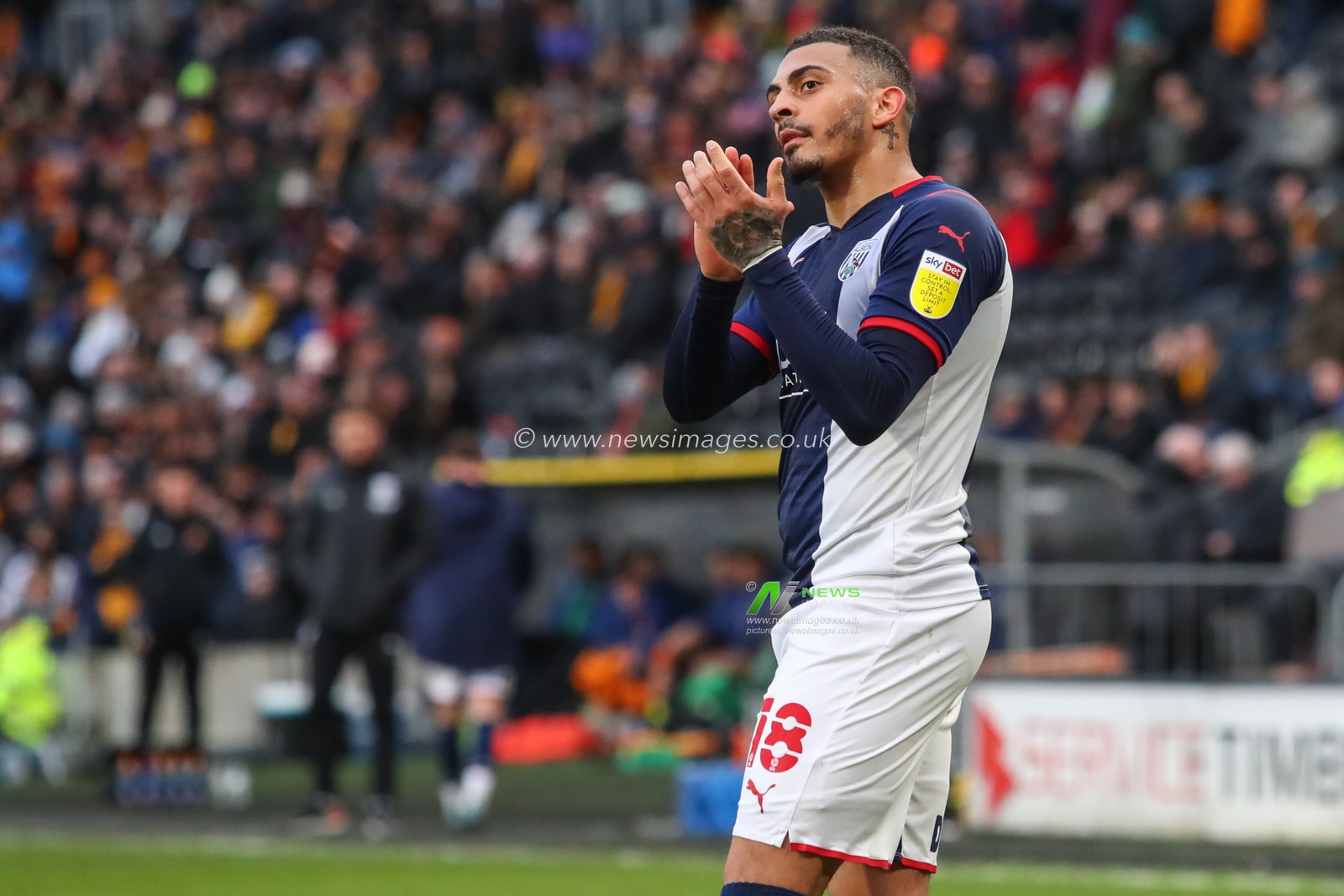 Karlan Grant #18 of West Bromwich Albion applauds the travelling fans