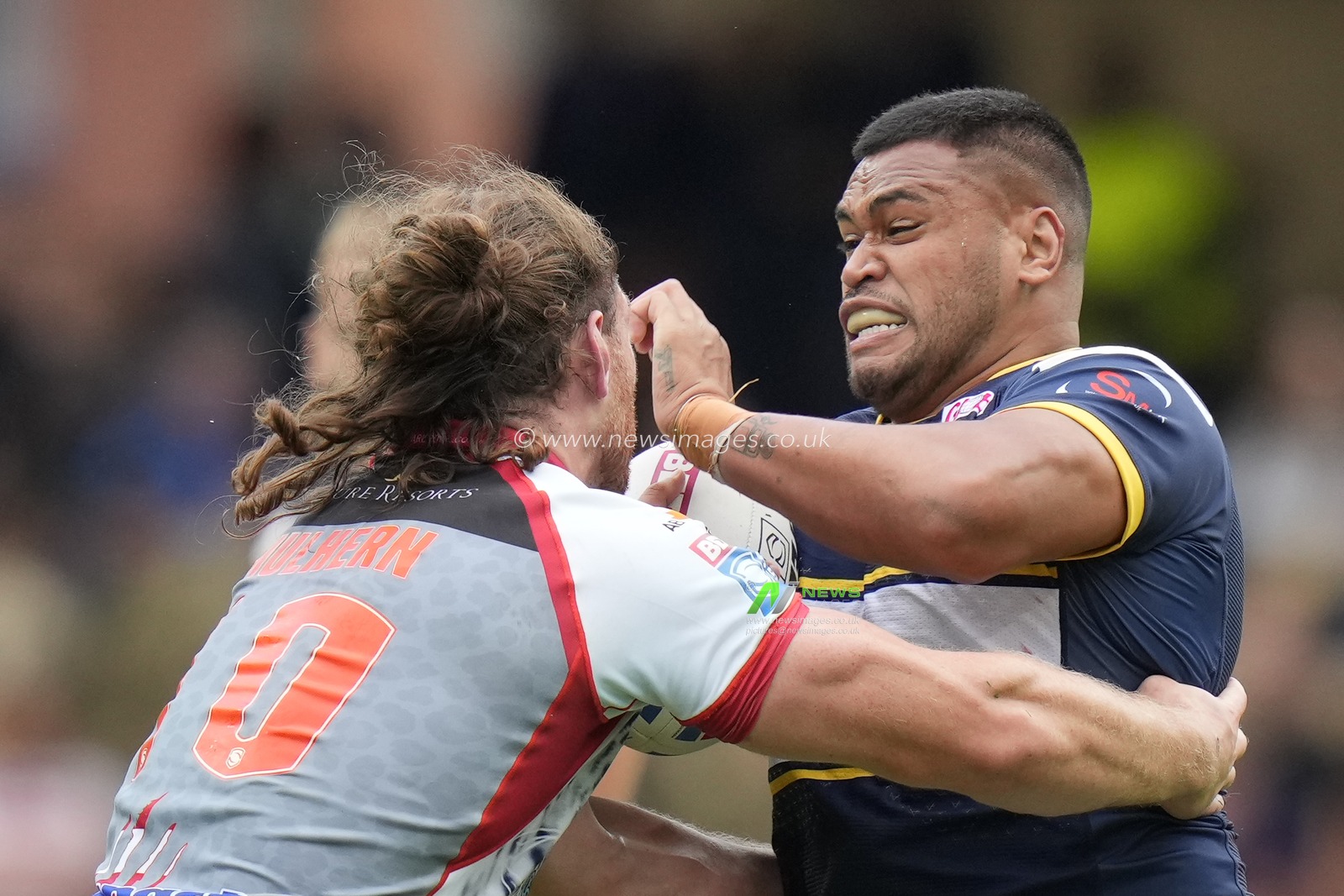 Robbie Mulhern #10 of Leigh Leopards tackles Sam Lisone #15 of Leeds Rhinos during the Betfred Super League Round 21 match Leeds Rhinos vs Leigh Leopards at Headingley Stadium, Leeds, United Kingdom, 6th August 2023

(Photo by Steve Flynn/News Images)