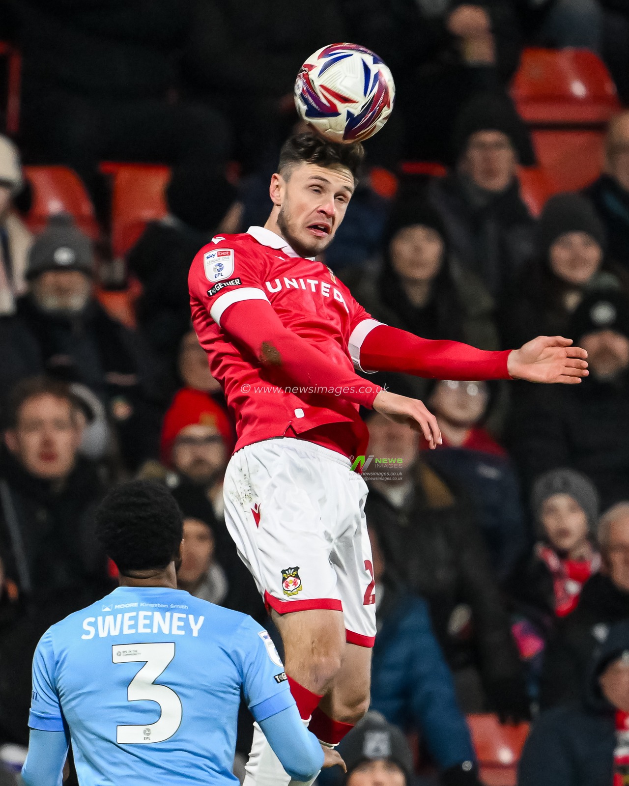 Ryan Barnett of Wrexham wins the header during the Sky Bet League 1 match Wrexham vs Leyton Orient at SToK Cae Ras, Wrexham, United Kingdom, 18th February 2025

(Photo by Craig Thomas/News Images)