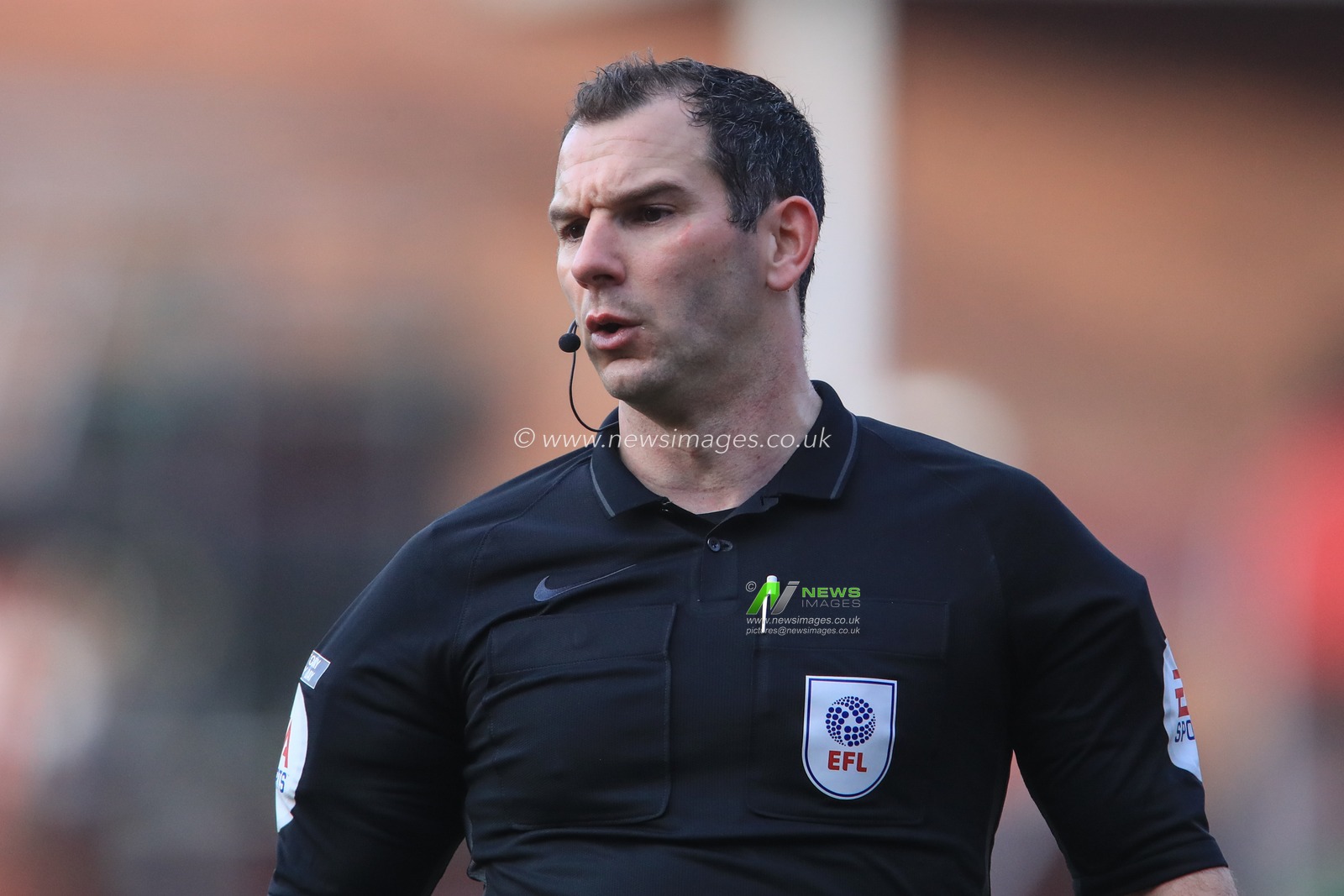 Referee Tim Robinson during the game