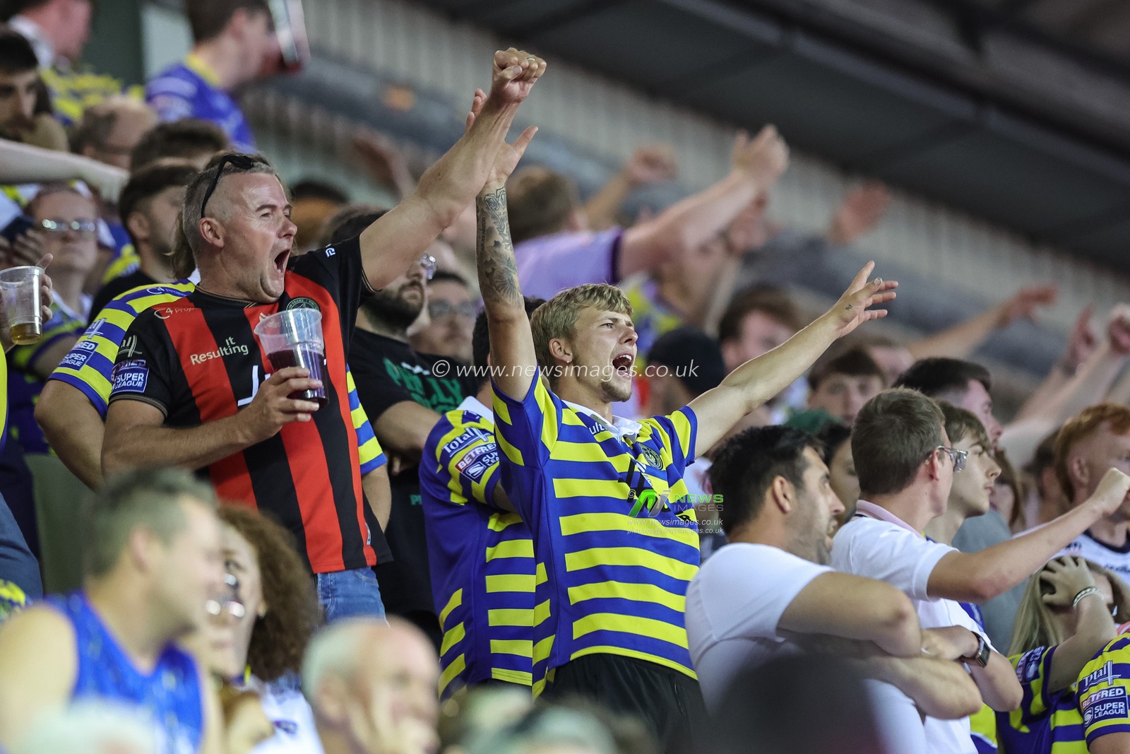 Warrington fans celebrate the try of Matty Ashton of Warrington Wolves during the Betfred Super League round 18 match Wigan Warriors vs Warrington Wolves at The Brick Community Stadium, Wigan, United Kingdom on 10 July 2026

(Photo by Mark Cosgrove/News Images)