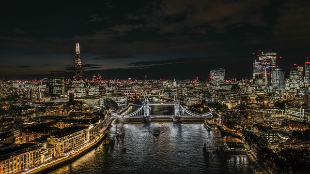 Aerial view of Tower Bridge and London City at night