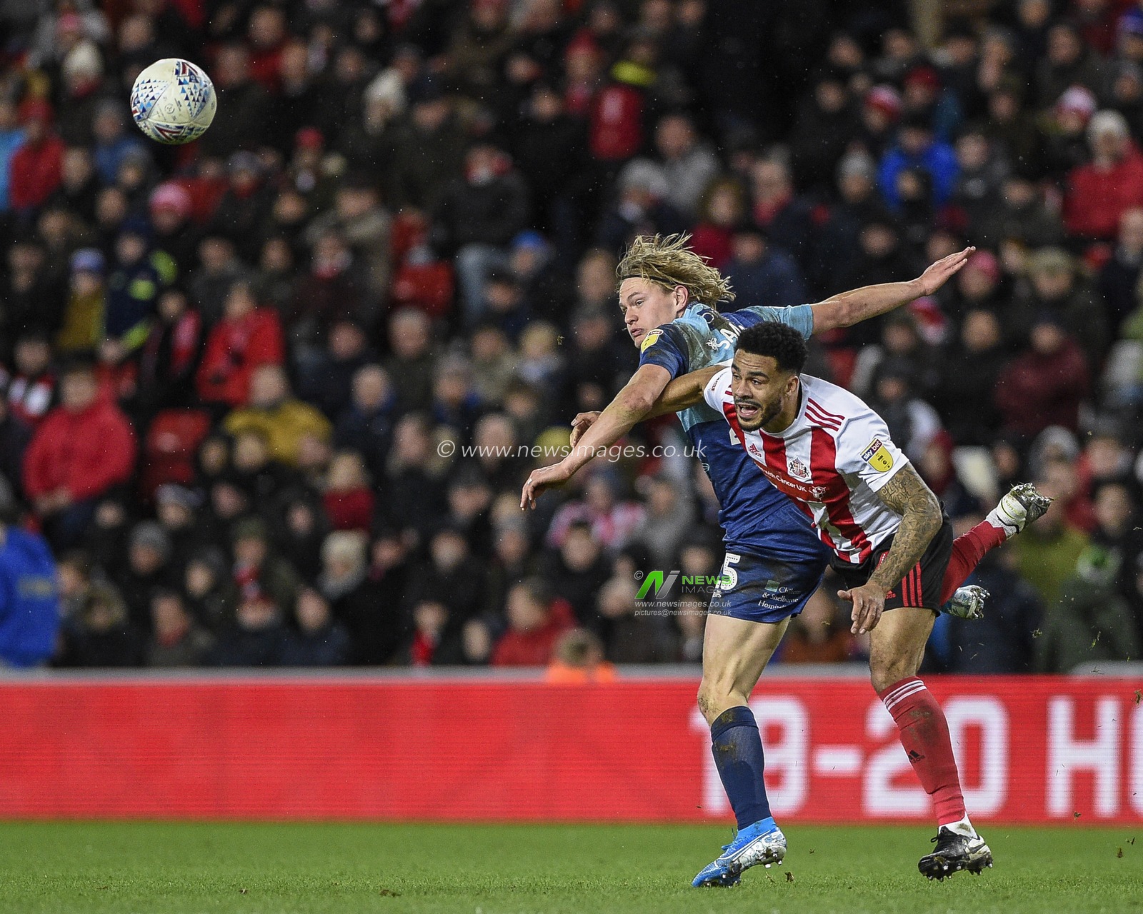 11th January 2020, Stadium Of Light, Sunderland, England; Sky Bet League 1, Sunderland v Wycombe Wanderers : Alex Samuel (25) of Wycombe Wanderers in an aerial challenge with Jordan Willis (4) of Sunderland

Credit: Iam Burn/News Images