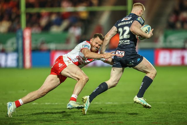 Joe Burgess of Hull KR dives in to tackle Zach Eckersley of Wigan Warriors during the Betfred Super League Round 7 match Hull KR vs Wigan Warriors at Sewell Group Craven Park, Kingston upon Hull, United Kingdom, 11th April 2025

(Photo by Alfie Cosgrove/News Images)
