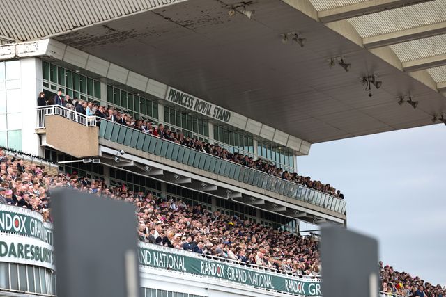 Racegoers look on as the 16:00 Randox Grand National Handicap Chase gets under way  during the Randox Grand National Day 2024 at Aintree Racecourse, Liverpool, United Kingdom, 13th April 2024

(Photo by Mark Cosgrove/News Images)