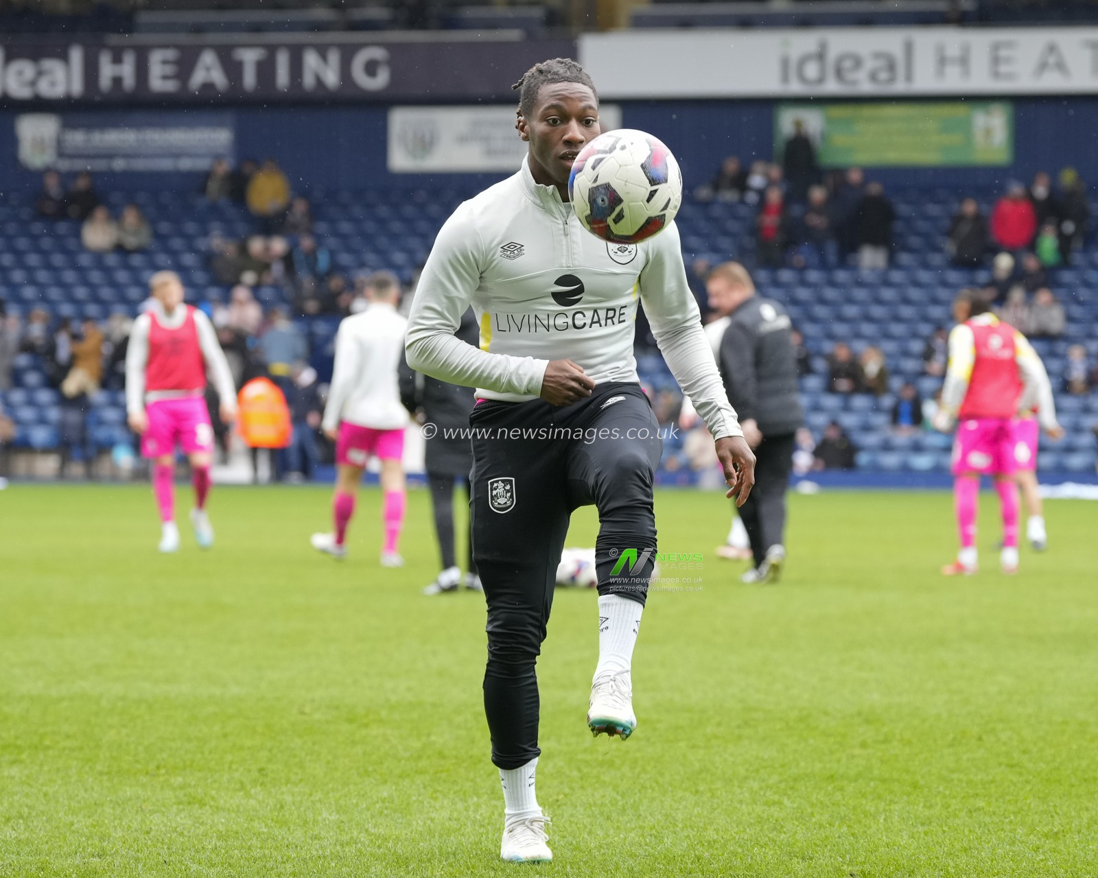 Joseph Hungbo #16 of Huddersfield Town warms up before the Sky Bet Championship match West Bromwich Albion vs Huddersfield Town at The Hawthorns, West Bromwich, United Kingdom, 11th March 2023

(Photo by Steve Flynn/News Images)