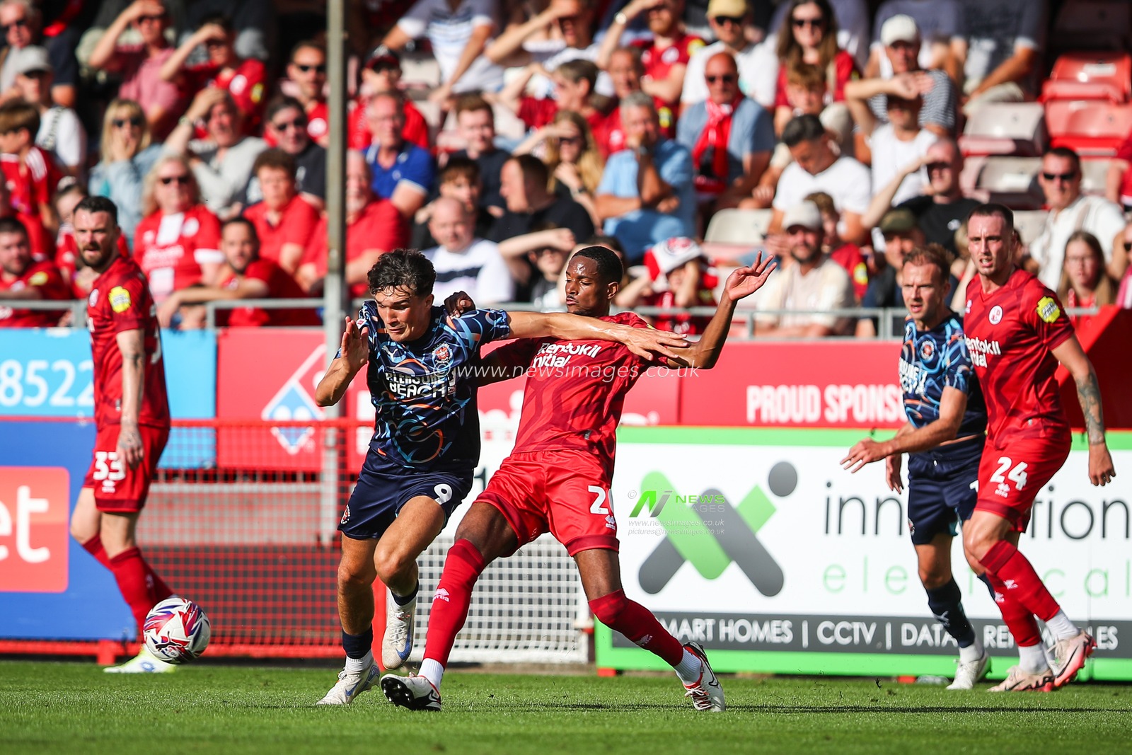 Joy Mukena of Crawley Town tackles Kyle Joseph of Blackpool during the Sky Bet League 1 match Crawley Town vs Blackpool at Broadfield Stadium, Crawley, United Kingdom, 10th August 2024

(Photo by Gareth Evans/News Images)