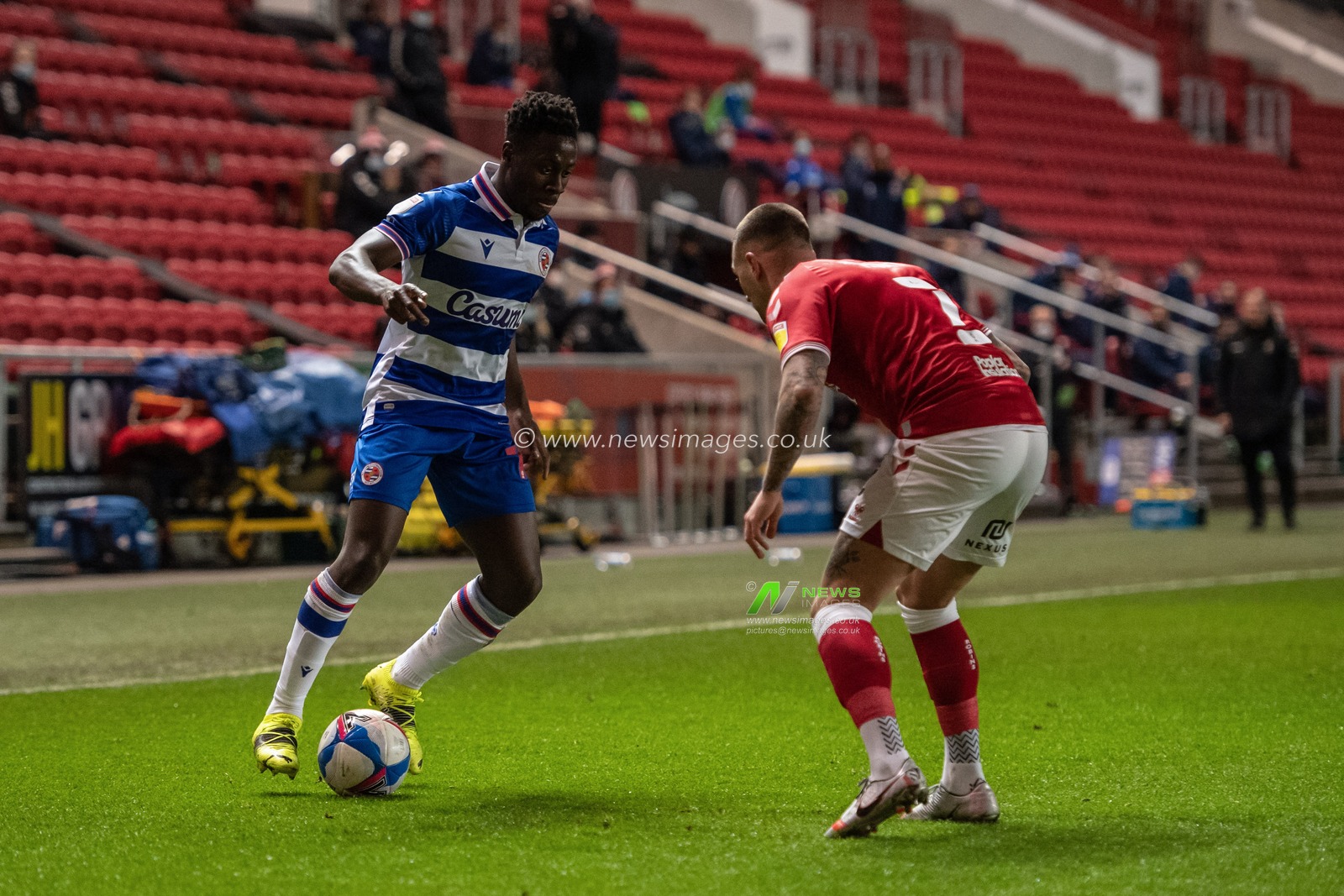 Andy Yiadom #17 of Reading looks to go past Jack Hunt #2 of Bristol City