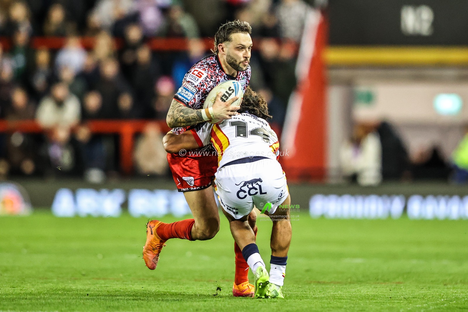 Gareth O'Brien of Leigh Leopards is tackled by Phoenix Laulu-Togaga'e of Catalans Dragons during the Betfred Super League match Leigh Leopards vs Catalans Dragons at Leigh Sports Village, Leigh, United Kingdom on 06 March 2026

(Photo by Alfie Cosgrove/News Images)