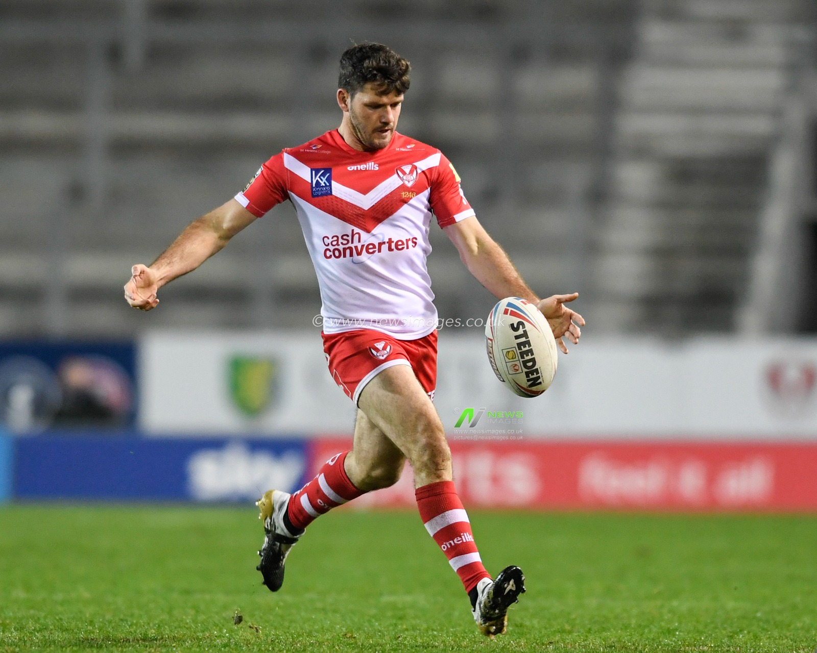 Lachlan Coote (1) of St Helens kicks the ball