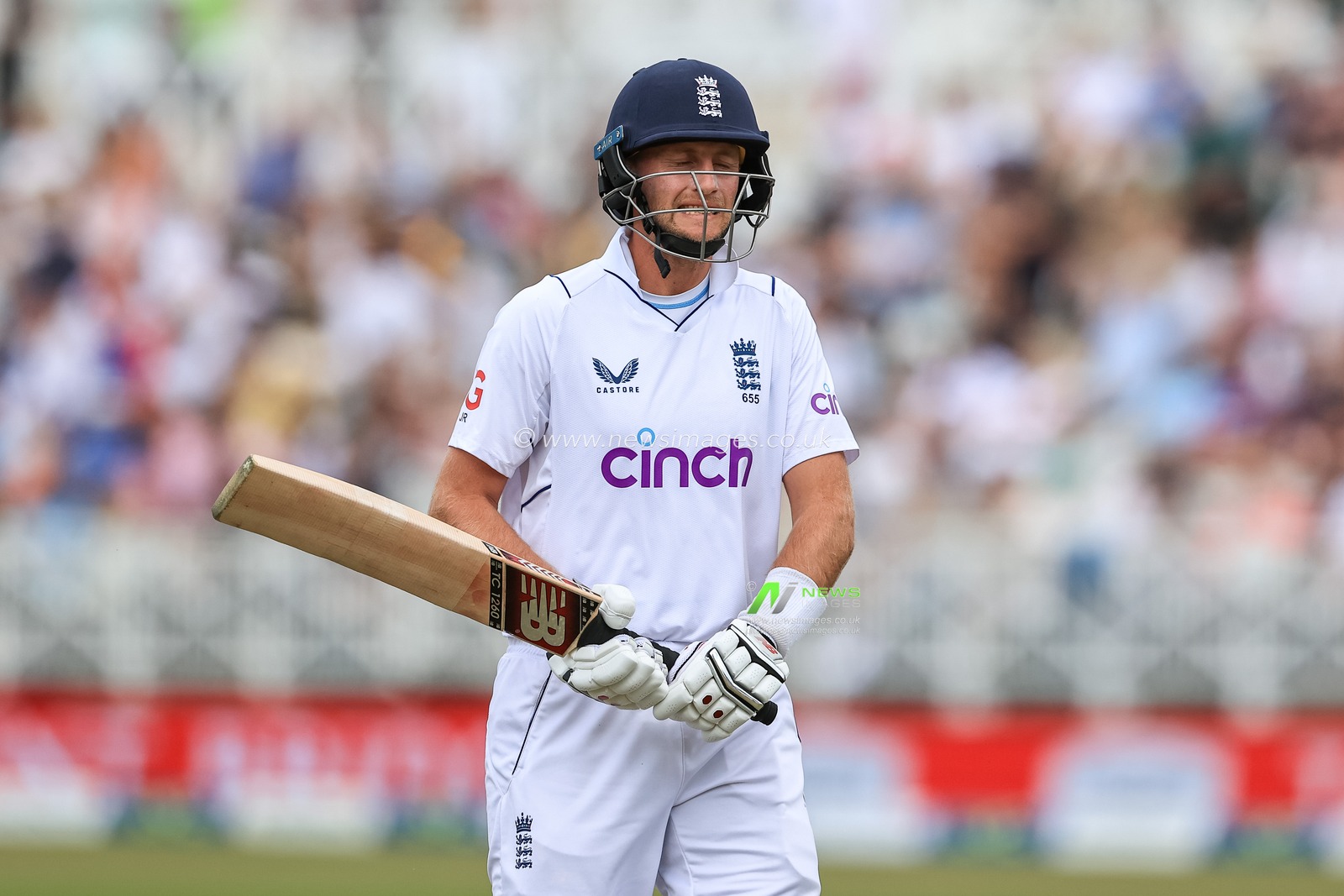 A dejected Joe Root of England leaves the field after being caught by Trent Boult of New Zealand