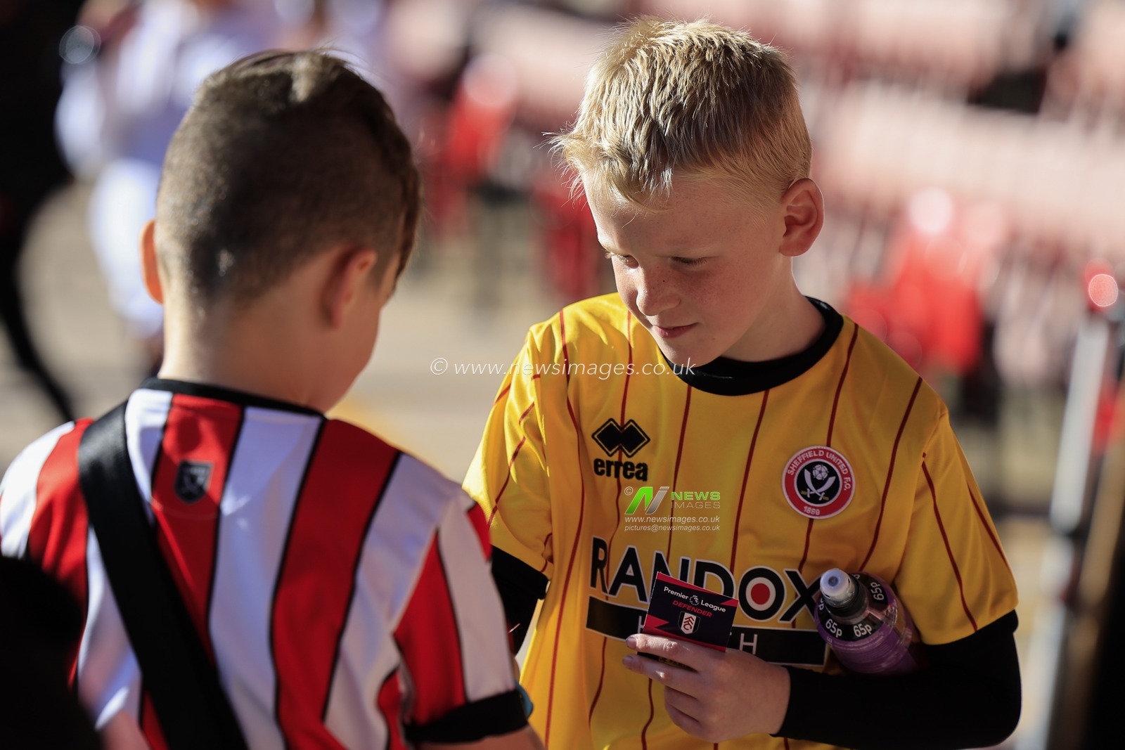 Young fans swop collectors cards during the Sky Bet Championship match Sheffield United vs Blackpool at Bramall Lane, Sheffield, United Kingdom, 15th October 2022

(Photo by Conor Molloy/News Images)