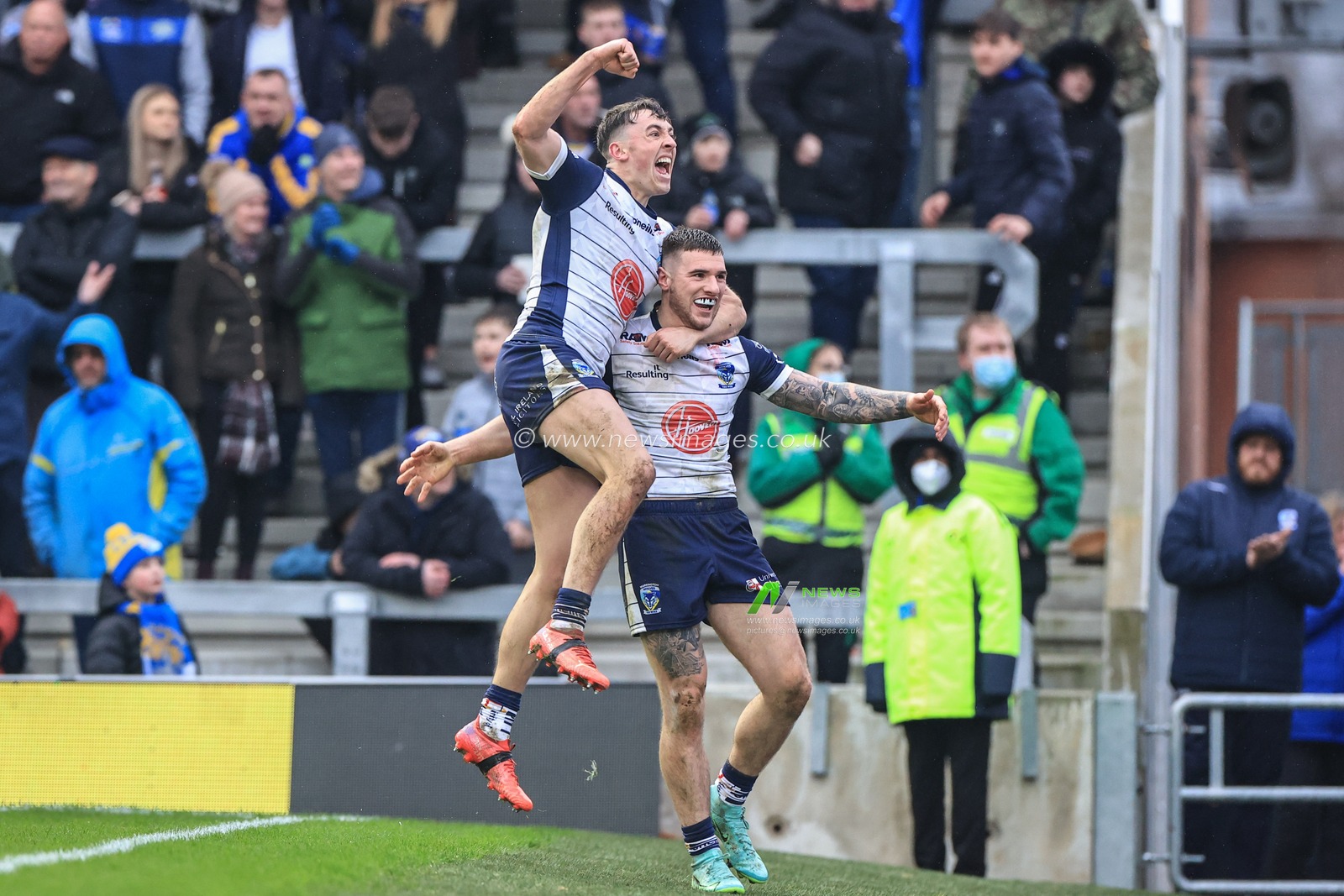 Connor Wrench #23 of Warrington Wolves celebrates his try with Matty Ashton #5 of Warrington Wolves