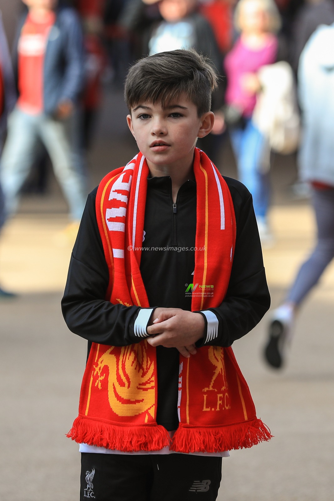 14th September 2019 , Anfield, Liverpool, England; Premier League Football, Liverpool vs Newcastle United ; A young Liverpool fans outside Anfield with his scarf on 


Credit: Mark Cosgrove/News Images 


Premier League/EFL Football images are subject to DataCo Licence