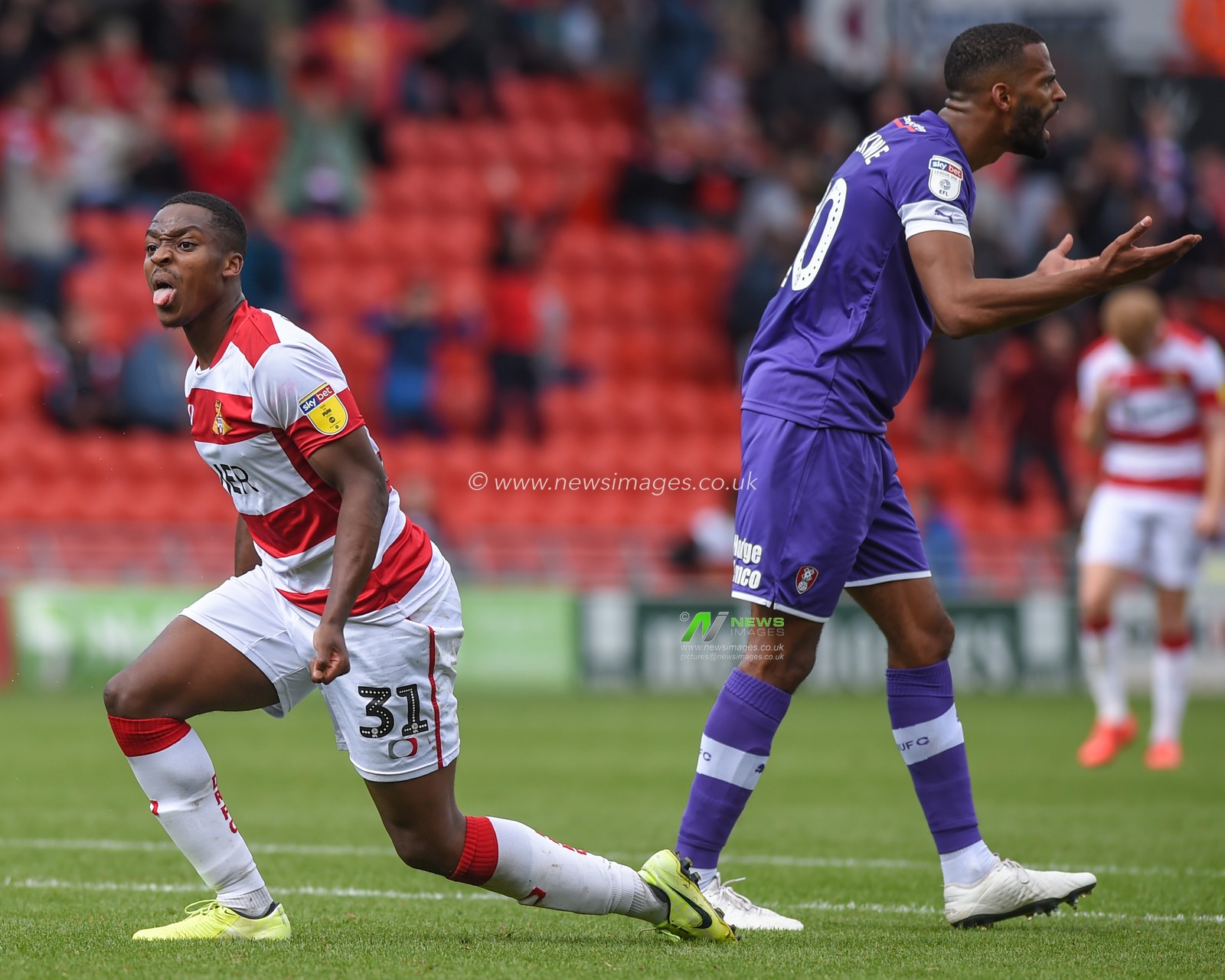 7th September 2019, Keepmoat Stadium, Doncaster, England; Sky Bet League One Football, Doncaster Rovers vs Rotherham United ; Niall Ennis (31) of Doncaster Rovers gcelebrates winnning a penalty while  Michael Ihiekwe (20) of Rotherham United remonstrates with referee Martin Coy. 

Credit: Dean Williams/News Images

English Football League images are subject to DataCo Licence