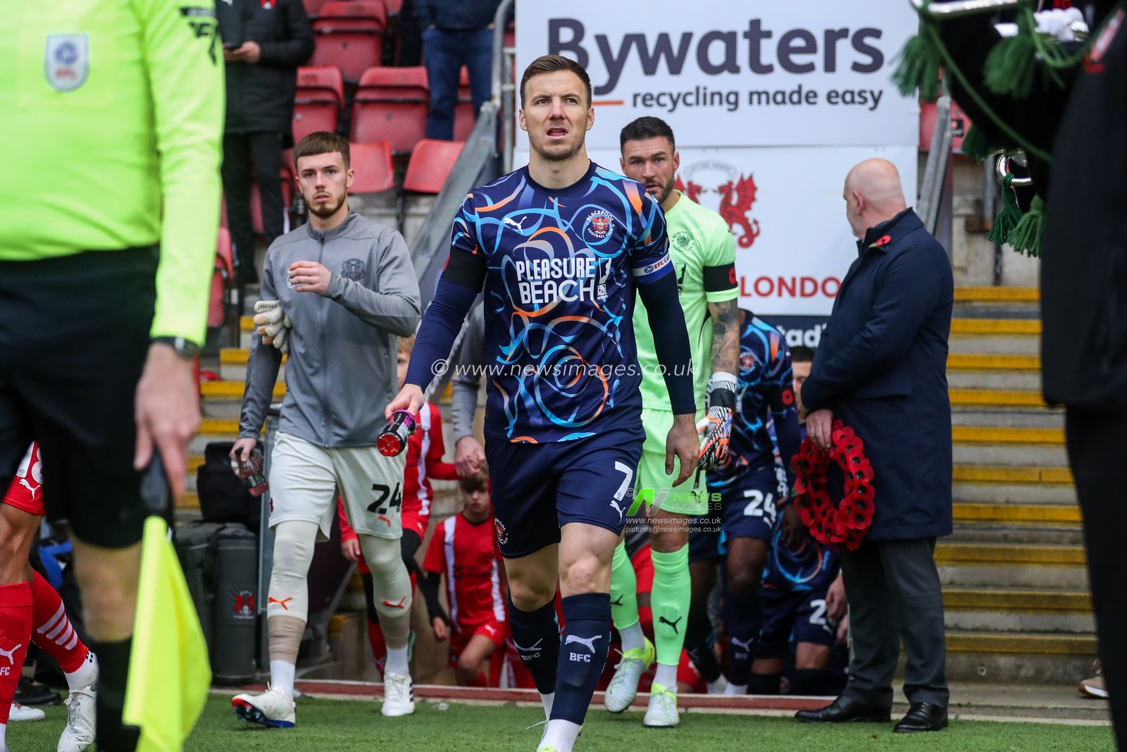 Lee Evans of Blackpool leads the team out onto the pitch prior to the Sky Bet League 1 match Leyton Orient vs Blackpool at Gaughan Group Stadium, London, United Kingdom, 9th November 2024

(Photo by Izzy Poles/News Images)