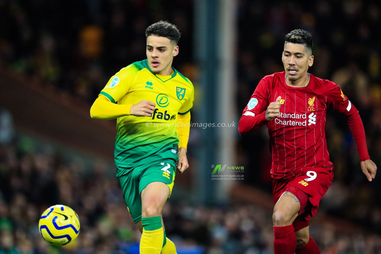 15th February 2020, Carrow Road, Norwich, England; Premier League, Norwich City v Liverpool : Roberto Firmino (9) of Liverpool and Max Aarons (02) of Norwich City challenge for the ball