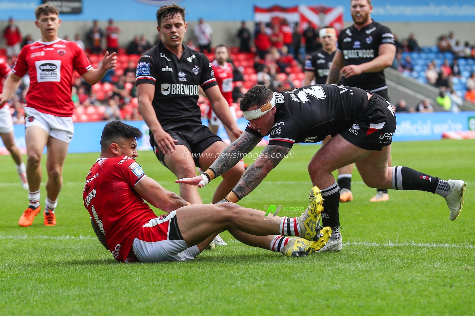 Tim Lafai of Salford Red Devils goes over for a try and makes the score 20-0 during the Betfred Super League Round 13 match Salford Red Devils vs London Broncos at Salford Community Stadium, Eccles, United Kingdom, 2nd June 2024

(Photo by Gareth Evans/News Images)