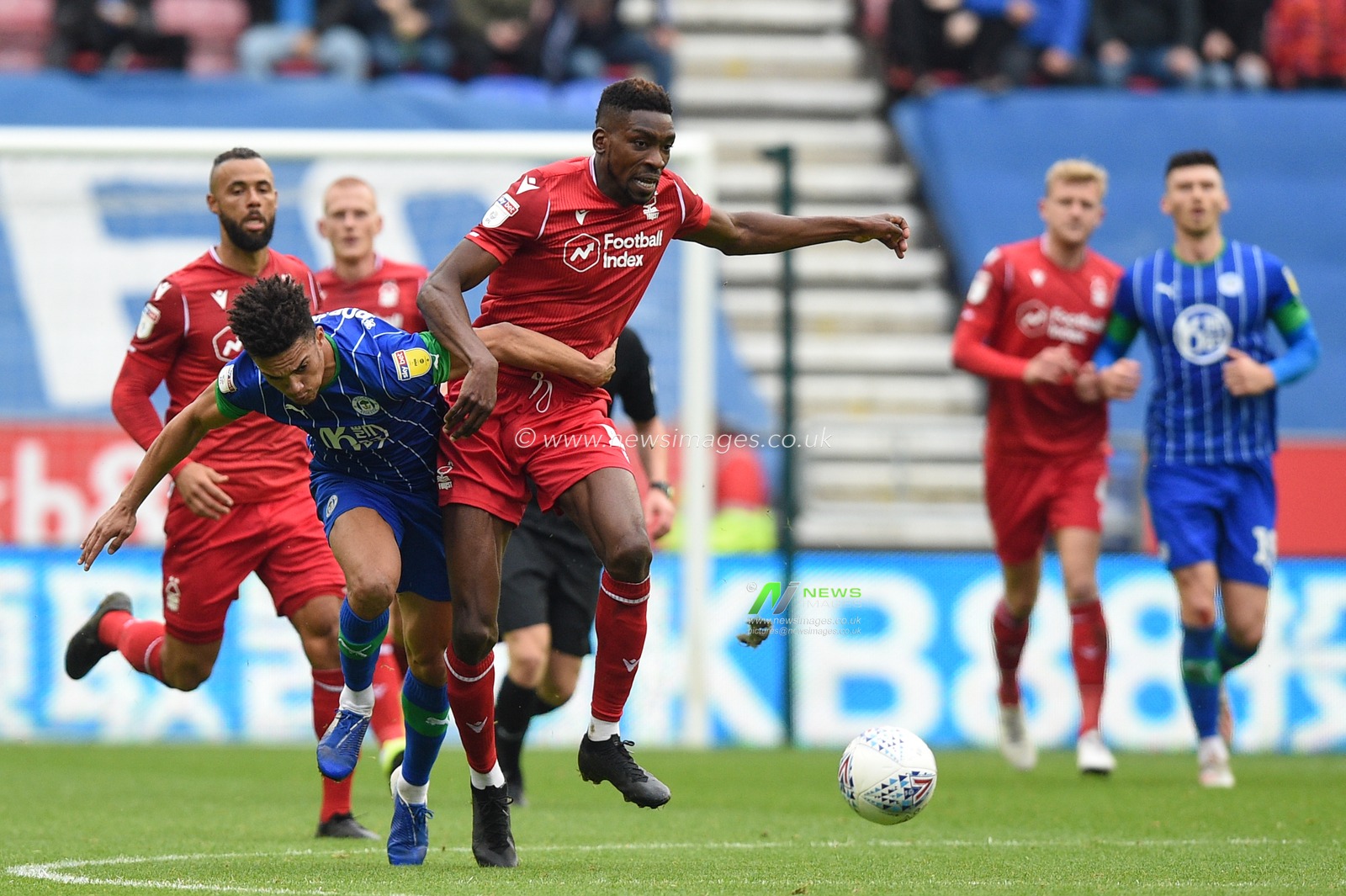 20th October 2019, DW Stadium, Wigan, England; Sky Bet Championship, Wigan Athletic v Nottingham Forest : Sammy Ameobi (19) of Nottingham Forest is challenged by Antonee Robinson (3) of Wigan Athletic 

Credit: Richard Long/News Images